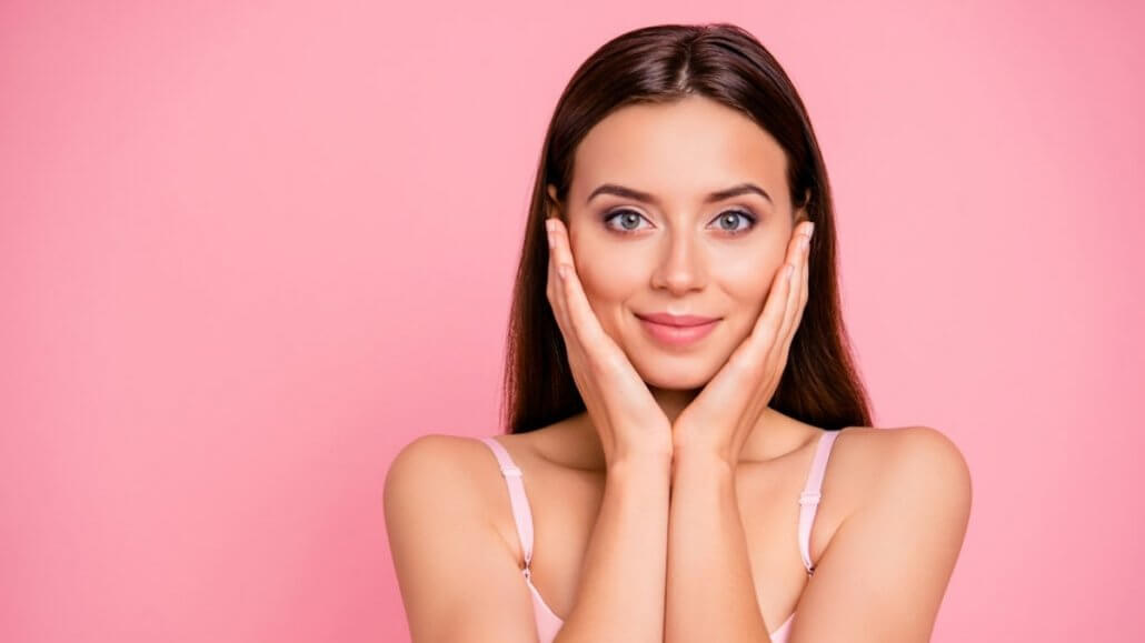 a woman after cleansing facial has good skin face