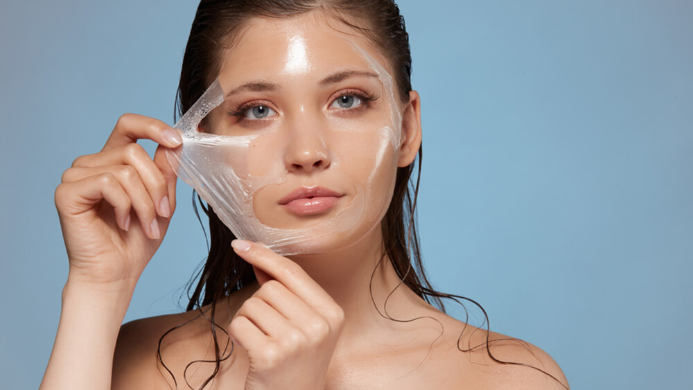 a woman uses chemical mask